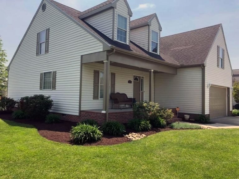 perfectly trimmed lawn, pathways and sidewalks around home